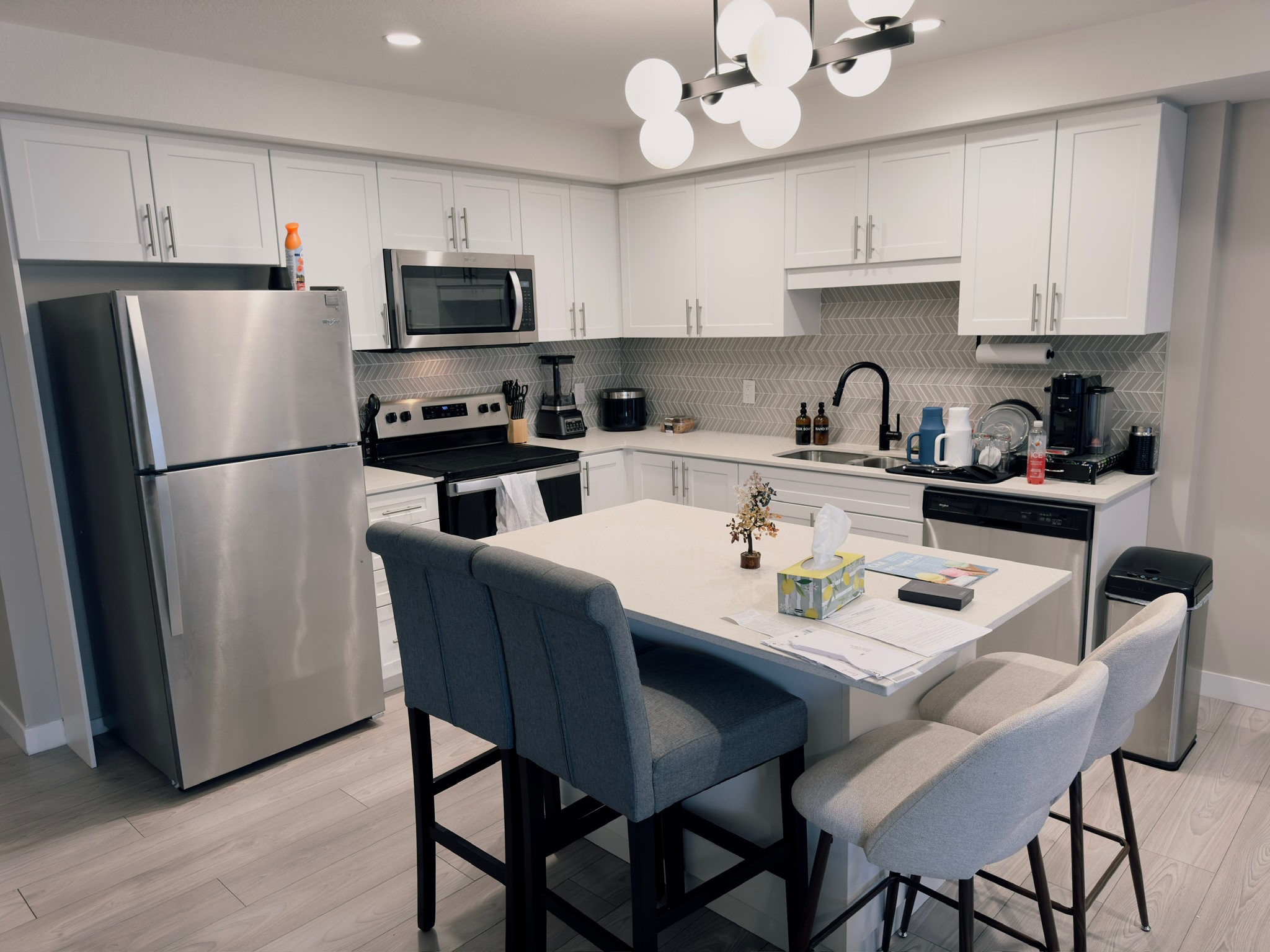 Symmetrical kitchen with white shaker cabinets